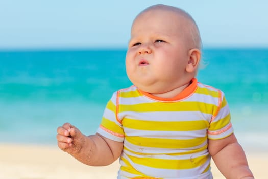 Cute baby on the tropical beach
