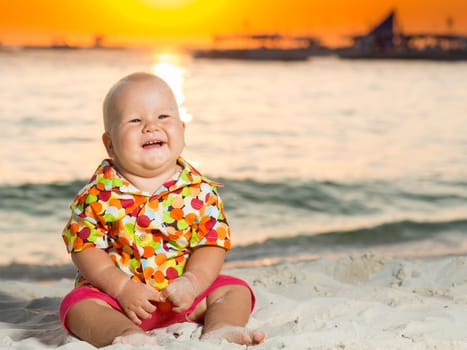Cute baby on the tropical beach