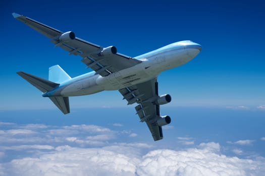 Plane,flying above the clouds in bright weather