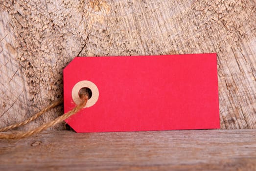 Red Tag with Copy Space for Your Text, on Wood