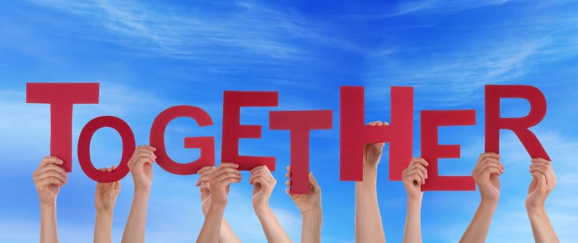 hands holding four pieces of a puzzle with copy space, gray background