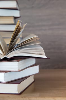 books on wooden deck tabletop