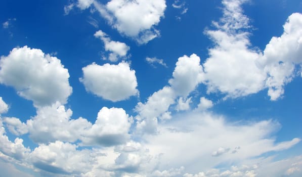 blue sky background with tiny clouds