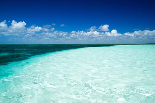 Blue sea under clouds sky