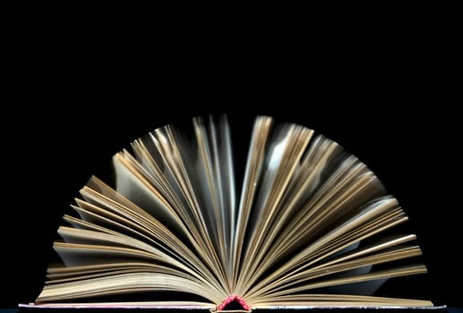 open book on black background