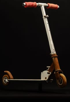 Metal scooter for child on white background