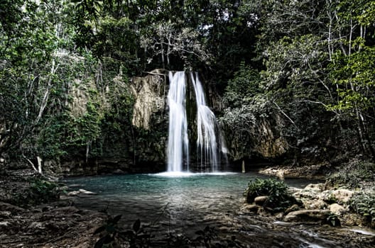 waterfall in deep green forest