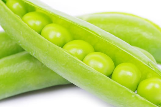 green peas vegetable closeup isolated on white