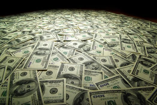 american dollars arranged at the background