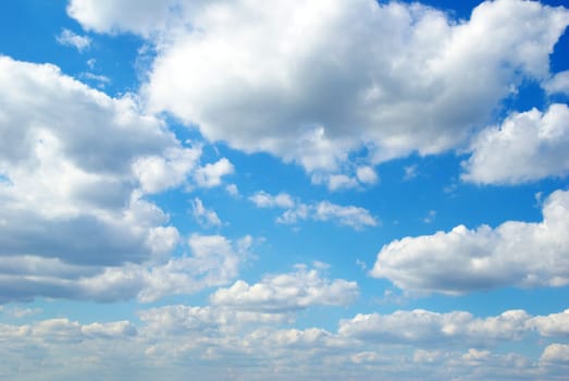 blue sky background with tiny clouds