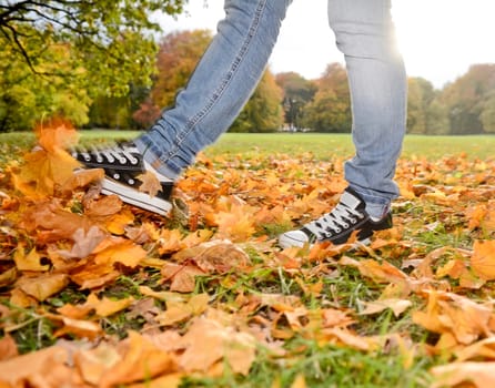 Feet in autumn foliage