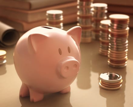Gold coins and silver around the piggy bank.