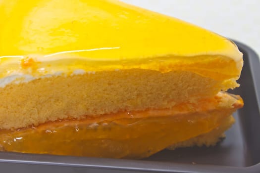 Dessert Orange Cheesecake in plate on background