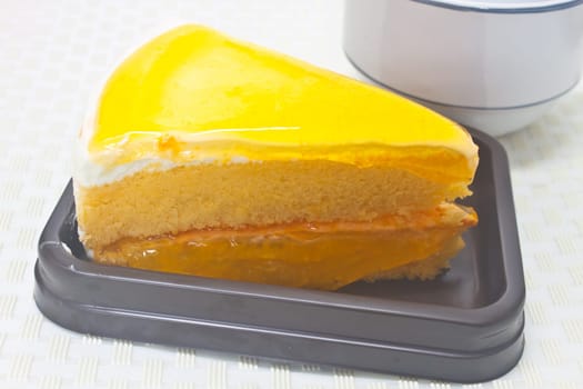 Dessert Orange Cheesecake in plate on background