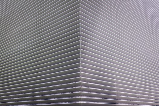 texture of steel ventilation grille on the wall of a building