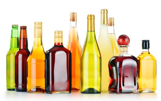 Bottles of assorted alcoholic beverages isolated on white background