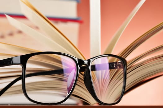 Composition with glasses and books on the table