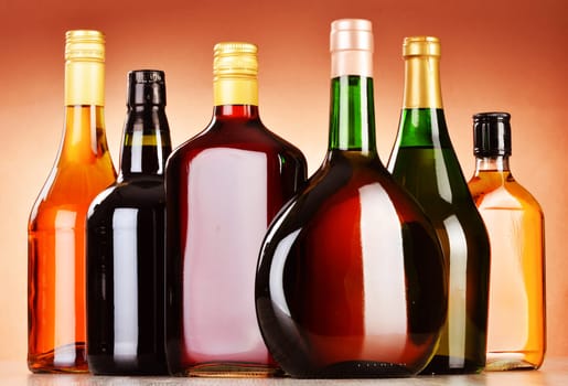 Bottles of assorted alcoholic beverages including beer and wine