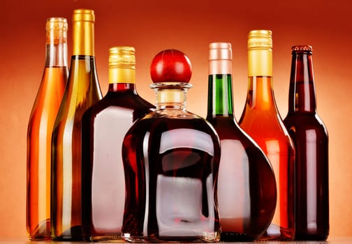Bottles of assorted alcoholic beverages including beer and wine
