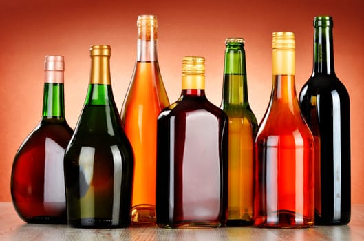 Bottles of assorted alcoholic beverages including beer and wine