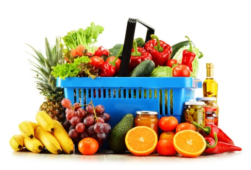 Plastic shopping basket with groceries isolated on white background