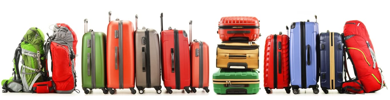 Luggage consisting of large suitcases and rucksack isolated on white.