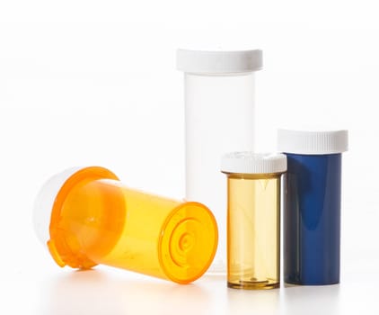 empty pill bottles on white background