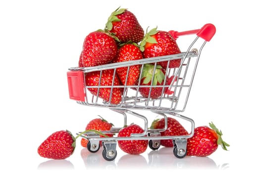 Strawberries in shopping cart isolated on white background
