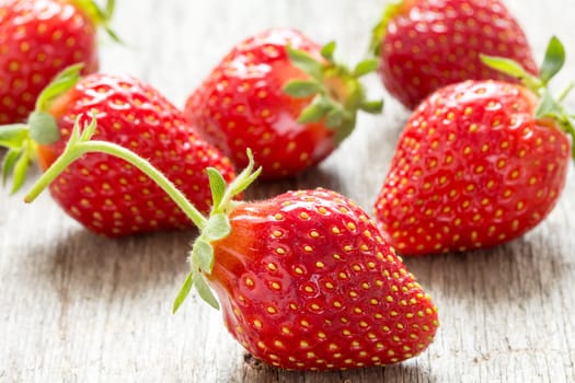 Close up fresh strawberries on wooden background