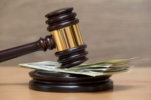Law gavel on a stack of American money