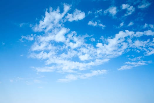 Blue sky background with a tiny clouds