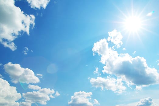 Blue sky with clouds and sun