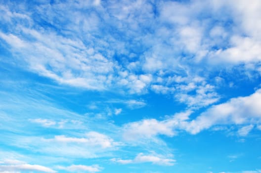 blue sky background with tiny clouds