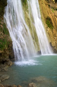 waterfall in deep green forest