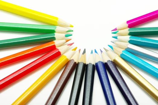 Assortment of coloured pencils  on white background