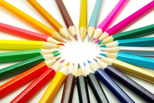 Assortment of coloured pencils  on white background