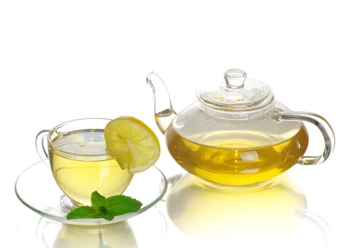 Tea being poured into glass tea cup
