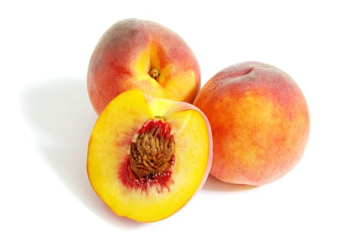 Fresh peach fruits isolated on white background