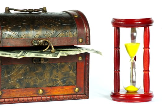 box with money and sand-glasses on a whiteness