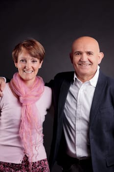 old couple loving each other smiling and looking at camera