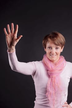 mature woman with a raised hand