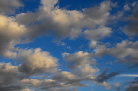 Cloudscape, Colored Clouds at Sunset near the Ocean