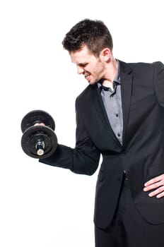Young male businessman in light suit with power lifts a dumbbell and shows strength and determination, isolated against white background