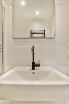 a bathroom with a sink and mirror on the wall next to it is an image of a glass shower door