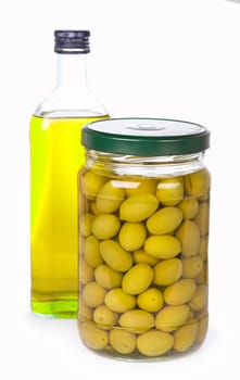 Green olives preserved in bank and a bottle of olive oil isolated on a white background