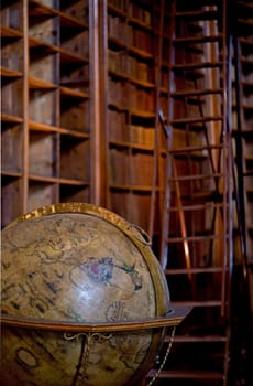 Vienna, Austria: Old bookcase with the leather-bound book covers in State Hall of Austrian National Library