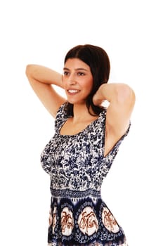 A beautiful brunette woman standing in profile in a nice dress, isolated.for white background..