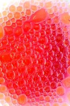Oil drops in red wine vinegar