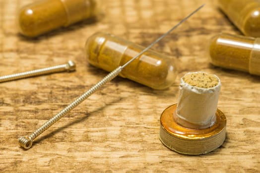 Acupuncture needle with moxa cone and herbal pills