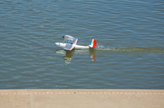 Radio controlled Hydroplane sailing over the Guadiana river surface, Badajoz, Spain